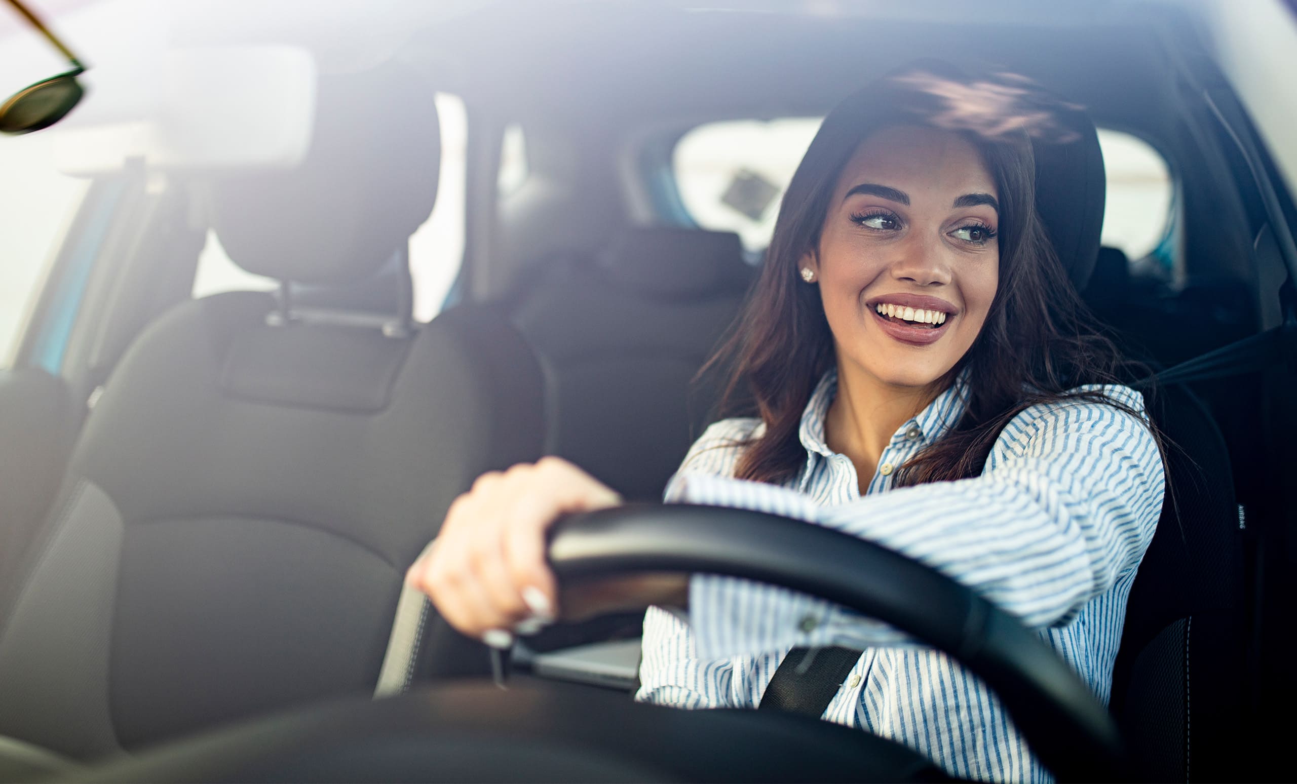 Woman driving car for title loans in Texas with Latte Loans