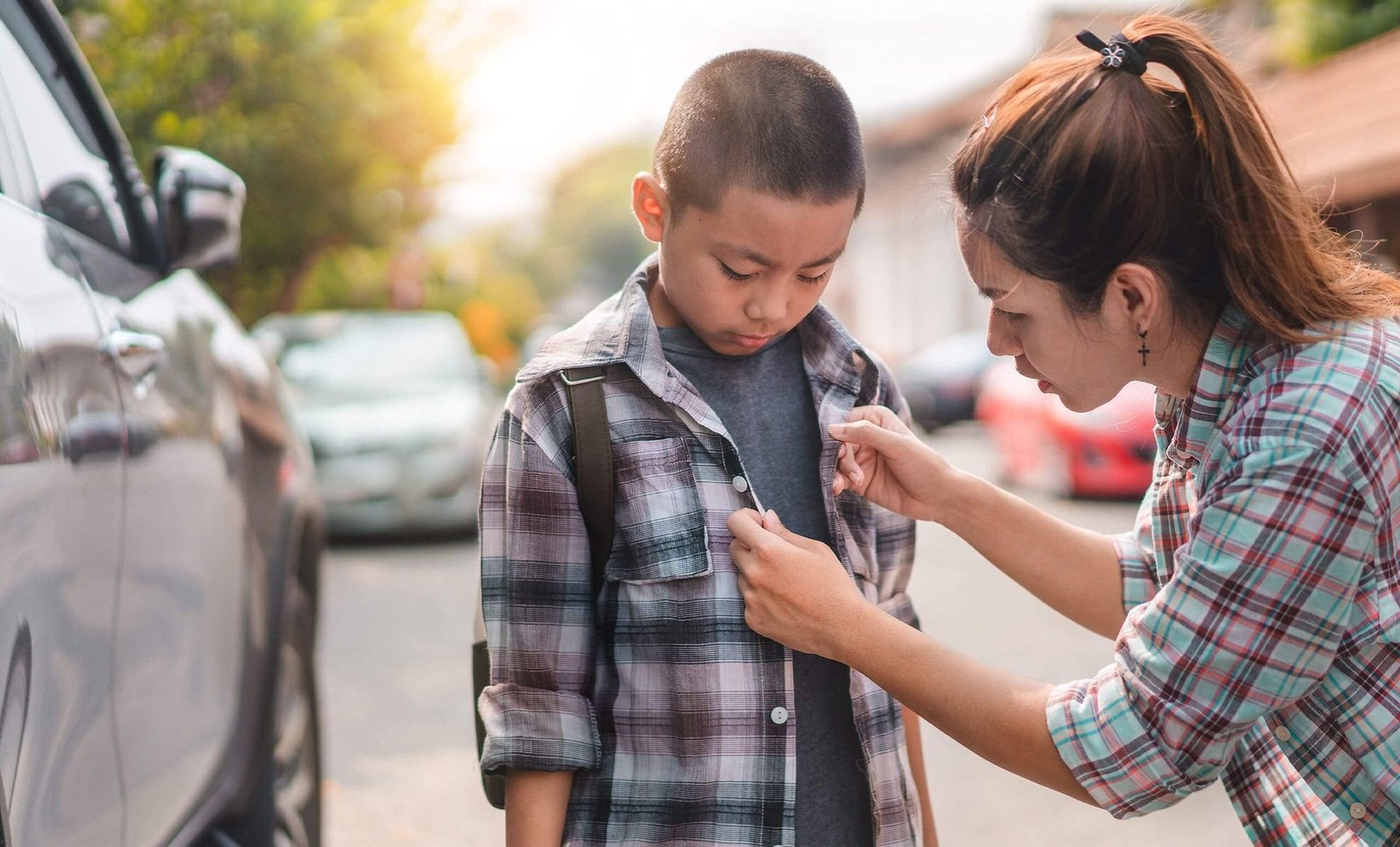 A mom helping her son get ready for school in 2025, with text overlay about using a Texas title loan from Latte Loans for back-to-school expenses.